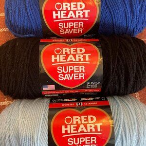 LOT OF THREE RED HEART SUPER SAVER yarn skeins, black, lt. blue, royal blue